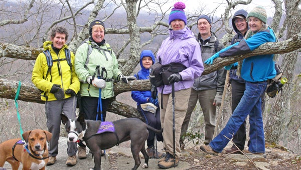 Liz Dicey, Maureen Pratt, Peggy Burke, Jackie Burke, Bob Leibfried, Carroll Rush and Annie Ewing, with Buck and Adel (two Foothills Humane Society adoptees) on Rattlesnake Rock at the PAC Hike to Florence Nature Preserve on March 1. (photo submitted by Pam Torlina)