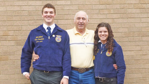 The Polk County High School FFA finished celebrating National FFA Week with a presentation on Feb. 15 in the Polk County High School auditorium by Bob Asfeld, owner of Asfeld Custom Combining in Beardsley, Minn. His company starts combining in Texas around the first of April and finishes in Canada around the first of November. During this time his six combines harvest almost 40,000 acres of crops. He has been doing this for more than 50 years and his business has been featured on the Discovery Channel. Polk County High School Math Teacher Pat McCool for organizing this presentation. Pictured at right are Asfeld Custome Combining owner Bob Asfeld, center, with Polk’s FFA vice-president Will Ballard and president Shalyn Brown. (photo submitted by Chauncey Barber) 
