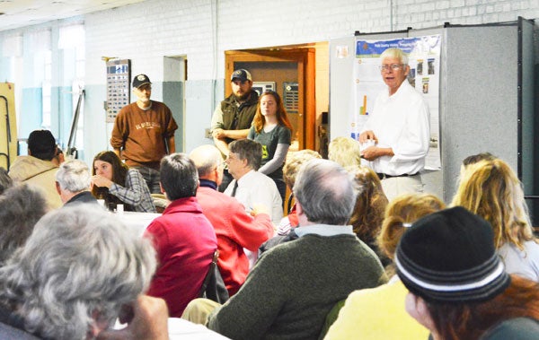 Lynn Sprague, right, talks to a crowd of agriculture supporters interested in the future of the Mill Spring Agriculture Center. (photo by Samantha Hurst)