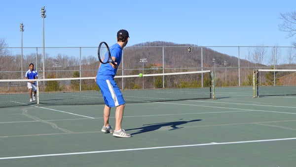 Andrew Lee prepares to hit one back over the net to his Highland Tech opponent. (photo by Chris Hurst)