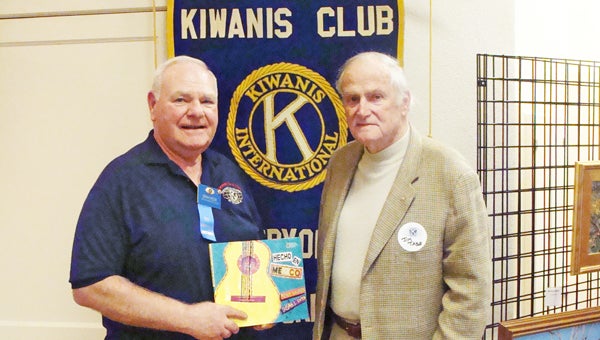 Jim Tabb, founder of the Blue Ridge Barbecue and Music Festival, spoke to the Tryon Kiwanis Club March 13. He discussed the history of the festival as it prepares to celebrate its 20th anniversary June 14-15 at Harmon Field in Tryon. Shown with Tabb, right, is Kiwanis member Denny Rook. (photo submitted by Lynn Montgomery)