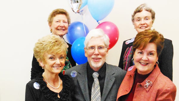 Celebrating at right, are members of FMC Inc.’s committee, led by chairperson John Gardner, who worked diligently to help achieve 501(c)(3) status for FMC. Clockwise from upper left:  Elaine Jenkins, Jeanette Shackelford, Jeri Board, John Gardner and Nancy Walburn. (photo by Ellen Harvey Zipf)