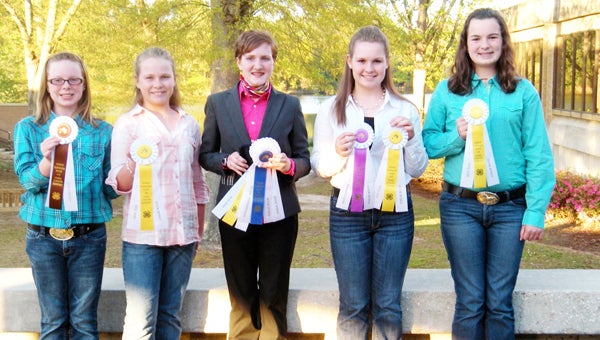 The Polk County 4-H Bridle Bunch Club recently participated in the State Horsebowl Competition, which took place at St. Andrews College in Laurinburg, N.C. The senior team placed third overall. Bradley Kay took first place in the halter class, second place overall in reasons and 10th place in the performance class. Bradley also took second place overall for the whole event. Katie Spurling was eighth overall in the halter class. Abbie Jennings was seventh overall in the halter class. Bridle Bunch Club members, left to right, Katie Spurling, Kaylie Jennings, Bradley Kay, Abbie Jennings and Jessica Spurling. (photo submitted by Helen Clark) 