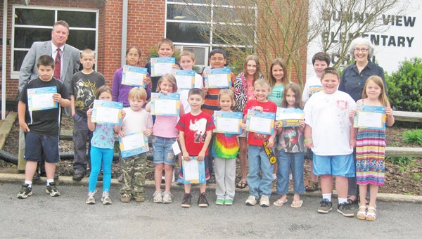 These students from Sunny View Elementary School were honored recently as Terrific Kids.  The Tryon Kiwanis Club sponsors the program, which recognizes students from each classroom for their good citizenship and hard work for the month.  Students received a certificate of honor, a pencil, and a bumper sticker that identifies their parents’ car as having a Terrific Kid in the family.  September winners were:  (L to R) - Front row – Hayden Stull, Kelsey Shelton, Casper Gibson, Miranda Laughter, Cameron McDowell, Tailynn Nelon, Dalton Hinger, Elise Brandon, Jesse Stepp and Cloey Shelton; back row -  Principal Kevin Weis, Christopher Hancock, Kahmarra Broe, Daniel Ruff, Coby Lee, Raphael Flores, Megan Blackwell, Sarah Strough, Tristan Mistler and Lynn Montgomery (Kiwanis). (photo submitted by Angela Hall)