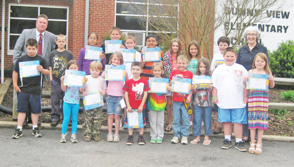 These students from Sunny View Elementary School were honored recently as Terrific Kids. The Tryon Kiwanis Club sponsors the program, which recognizes students from each classroom for their good citizenship and hard work for the month. Students received a certificate of honor, a pencil, and a bumper sticker that identifies their parents’ car as having a Terrific Kid in the family. September winners were: (L to R) - Front row – Hayden Stull, Kelsey Shelton, Casper Gibson, Miranda Laughter, Cameron McDowell, Tailynn Nelon, Dalton Hinger, Elise Brandon, Jesse Stepp and Cloey Shelton; back row - Principal Kevin Weis, Christopher Hancock, Kahmarra Broe, Daniel Ruff, Coby Lee, Raphael Flores, Megan Blackwell, Sarah Strough, Tristan Mistler and Lynn Montgomery (Kiwanis). (photo submitted by Angela Hall)