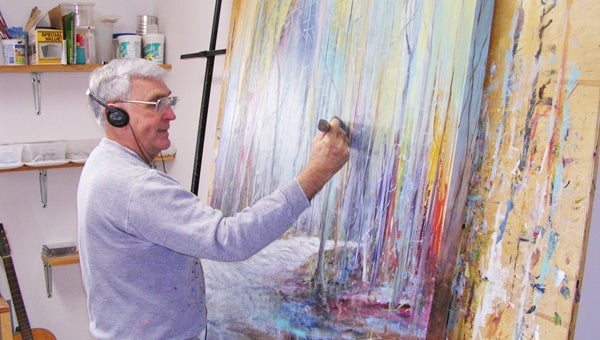 Jim Shackelford is shown in his studio putting the finishing touches on a painting for Art Trek Tryon.  On Saturday, April 27, from 10 a.m. - 5 p.m., and Sunday, April 28, 12:00 noon- 5:00, area artists will open their studios for people to tour, see artists at work and purchase favorite pieces to take home with them. On Friday, April 26, the Preview Party for Art Trek Tryon will take place from 5-8 p.m. at the Upstairs ArtSpace in downtown Tryon. The public is invited to attend and see representative works from all the artists participating in The Trek. (photo submitted by Jim Shackelford)