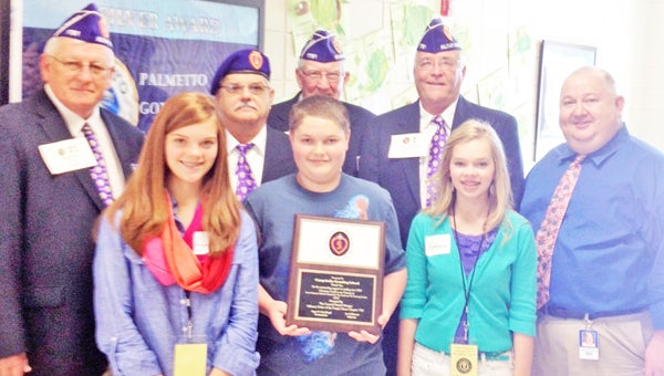 Campobello Gramling School was awarded with the Military Order Purple Heart Award on April 10. Students proudly made more than 1,900 Christmas cards for veterans at the Dorn Veterans Medical Hospital and The Anderson VA Nursing Facility in December 2012. Students and faculty received the honor this past Wednesday at their annual veterans program. Pictured are, back row, Ronnie Ray, Randy Crocker, Roger McCullough and George Kaucher; front row, Annie Kate Hodge, Ashby Cartee, Bethany Ghent and David Whitaker. (photo submitted by Lacey Camp and Kenslee Crocker)