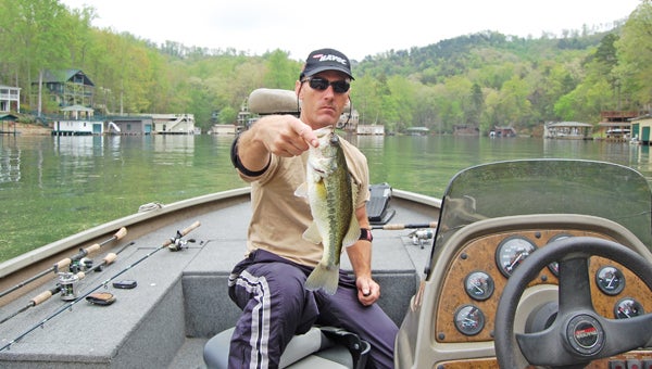 Rob McComas with a largemouth bass caught on Lake Lure. (photo submitted)
