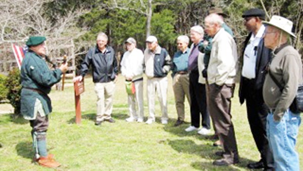 A senior men’s group from Tryon Estates recently visited the historic Walnut Grove Plantation in Roebuck, S.C. Zac Cunningham, director of the Walnut Grove Plantation and Historic Price House, hosted the group. The outing was led by Ralph Collins, a resident of Tryon Estates, and Tom Foster, a staff member.  From the plantation’s literature: “Walnut Grove Plantation tells the stories of the free and enslaved people who settled South Carolina and the rest of Britain’s American colonies, fought for independence, and in the end built a new nation. Among the first to settle this area of the backcountry (as South Carolina’s tough western frontier was then called), Charles and Mary Moore established Walnut Grove on a 550-acre land grant about 1763.” The plantation and the area around it saw much conflict during the Revolutionary War. The plantation’s literature goes on to say: “Local militia troops mustered at Walnut Grove before joining American forces at the Bottle of Cowpens in January 1780.” The plantation’s buildings have been maintained in excellent condition and the group further heard stories from a reenactment frontiersman soldier from the period as shown in the photo. Following the tour the group enjoyed lunch at the Beacon Drive-In in Spartanburg before returning to Columbus. For further information about the plantation, visit spartanburghistory.org/walnutgrove.php. (photo submitted by Frank Collins)