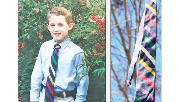 2001: 7 year old Madison Alexander wearing his first neck tie (boys’ size, of course) 2013: that same neck tie hanging among all the full sized men’s ties on Trade Street as part of the April Fool’s Day decoration. (photos submitted by Mimi Alexander)