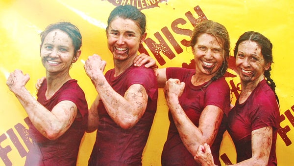 During the historic 20th anniversary of the USMC Mud Run held in Columbia, S.C. on April 27, a local team took first place honors in the All-Female Division. Team No. 109, consisting of Mandy Wolfe, Lori Geddings, Ellen Seagle and Mary Mujica, conquered a 6.2-mile all-terrain course with 36 military obstacles, which included walls, trenches and mud holes. Team members had to work together to strategically maneuver through each obstacle, which involved climbing, swimming, crawling or jumping. “We had practiced course attack and execution and we were very pleased with the results,” Wolfe said. This biannual event raises money, awareness and support for marines, veterans and their families across the nation who have been wounded or killed while serving on active duty. Above: Mandy Wolfe, Lori Geddings, Mary Mujica and Ellen Seagle. (article submitted Lori Geddings)