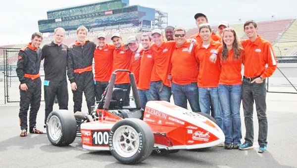 Members of Clemson’s Formula SAE team, including Polk County native Perry Ellwood, third from left in black suit. (photo submitted)