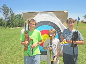 At right, Archery members, left to right, is Rick Burney, Josh Streacker and Phil Burney display their awards. Rick shoots a compound bow, Josh shoots barebow recurve and Phil shoots Olympic recurve.