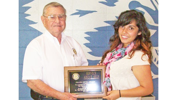 Savannah Marino, right, is pictured with Rotarian Paul Sutherland. Marino  was the winner of the Ortiz Service above Self Award for Interact Club members at Polk High. The award recognizes the senior that embodies the Rotary Moto -Service Above Self. In addition to a plaque, the award carries with it a $1,000 check for the winner. (photo submitted by Paul Sutherland)