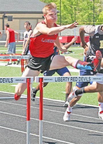 Landrum High School Cardinal Samuel Jessup Robinson leaps over hurdles during the 2013 District Track and Field Championships held Friday, April 26. Landrum plays host to the Upper State Track and Field meet Saturday, May 4 beginning at 11 a.m. (photo by Lorin Browning) 