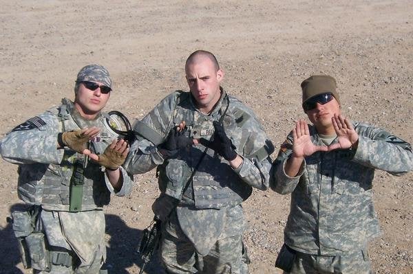 Adam Palmer, center, and fellow soldiers in Iraq. 