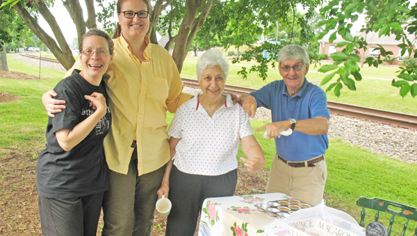 Pictured are Cecilia England, Emily Anas, Judy Matheis and Jon Matheis at the Landrum Farmers Market on Saturday, June 1. England sells goat milk and cheese and Emily Anas was selling homemade blueberry muffins. Landrum Farmers’ Market meet on North Trade St. from 7-11 a.m. near the depot. (photo submitted by Anne Regan)