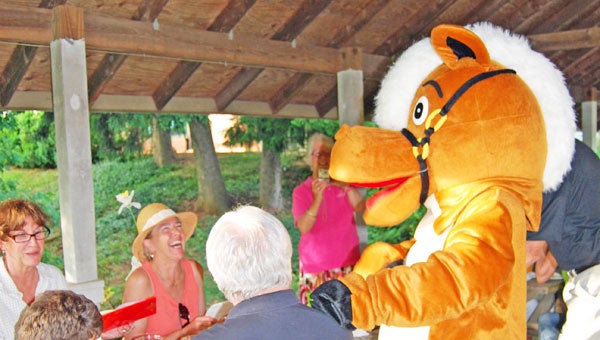 Trotter, TROT’s mascot, having fun with the crowd.