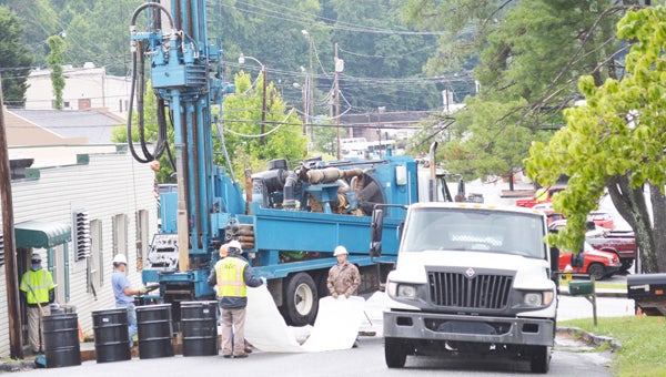The Town of Tryon has had Palmer Street closed this week so crews could complete  repair work to a culvert. A sinkhole occurred a few weeks ago following a thunderstorm and the town discovered that the culvert running under Palmer Street had collapsed, according to town manager Joey Davis. (photo by Leah Justice)
