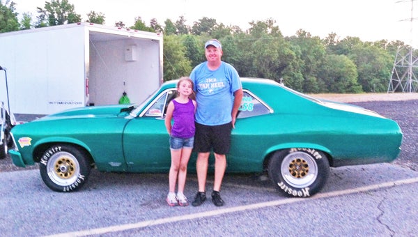 Chad Dotson of Mill Spring, was the first place winner in the footbrake class this past Saturday, June 22nd, at the Greer Dragway. Dotson was driving his 1972 Chevy Nova. Dotson is currently 2nd in the points season. Pictured above are Chad Dotson and his oldest daughter, Lauren Dotson.
