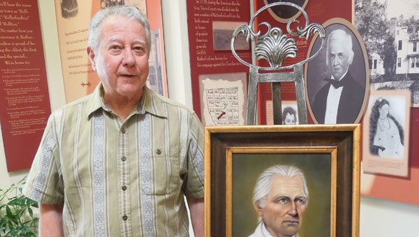 Ambrose Mills of Tryon, a direct descendent of Colonel Andrew Hampton, assisted with the unveiling of a portrait of the Revolutionary War hero, at a special ceremony at the Rutherfordton Town Hall on July 19. (photo submitted)