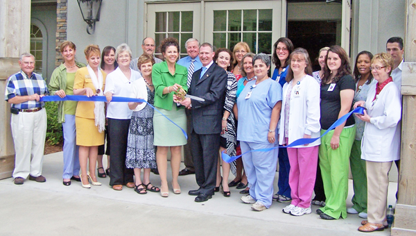 Almost 200 people attended the grand opening reception and ribbon cutting ceremony held July 10 to mark the official opening of the new St. Luke’s Medical Building. Tours and refreshments were offered to highlight renovations to the office building located at 89 W. Mills St., Columbus. St. Luke’s Medical Building is the new home for Rosenberg Bone and Joint and for the St. Luke’s Hospital Foundation. Members of the community and the Carolina Foothills Chamber of Commerce attended the celebration along with St. Luke’s staff, board members, patients and donors. Participating in the ceremonial ribbon-cutting were Meshelle Colvin (with scissors), executive director of the St. Luke’s Hospital Foundation and Chamber of commerce board member; Brian J. Rosenberg, MD, of Rosenberg Bone & Joint; staff and foundation board members. (photo submitted by Janet W. Sciacca)