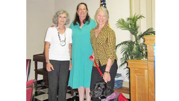 Pictured from left to right are Rotarian Carole Bartol with Mary Ann Merrill and Ann Goodheart who are co-founders of Service Animal Project at Foothills Humane Society. Joining the two SAP volunteers is Hawk a FHS dog who is being trained to be in the SAP program.   Service Animal Project (SAP) identifies and accesses shelter and rescue dogs that are trained, then matched with wounded warriors through the K-9s for Warriors Project.  Merrill presented the program on SAP at a recent Rotary Club of Tryon meeting.  For further information, contact SAP via e-mail at: serviceanimalproject@windstream.net. (photo submitted by Judy Lair) 