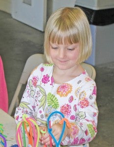 From last month’s art and music classes based on the curriculum “Creature at the Ocean” is Ella McCall making an undersea sculpture full of colorful creatures. For information or to register, visit www.tryonarts.org or call education director Marianne Carruth at 828-859-8322, ext. 213.