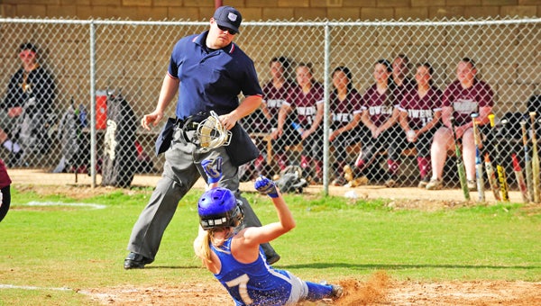 Amber Lynch sliding home without a play. Lynch received All-District honors, but did not make All-State, in spite of her .400 batting average this past season. (photos by Mark Schmerling)