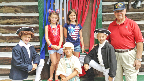 Rollins Carter as Thomas Jefferson, reader Ellie Mitchell, Hayden Blackwell as Betsy Ross, National Anthem soloist Ella Waldman, Sydney Waldman as George Washington and Pledge of Allegiance leader Lt Colonel John A. Albee (Ret.) (photo submitted by Renae Waldman)