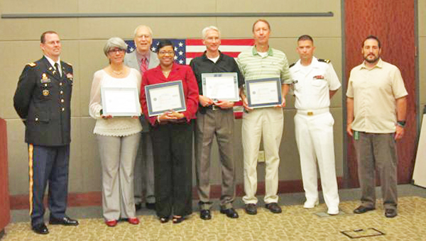 Polk County resident, retired Army Colonel Robert Lair of the N.C. Committee for Employer Support of the Guard and Reserve, third from left, presented the awards to supervisors at the corporate headquarters in Mooresville, N.C. (photo submitted)