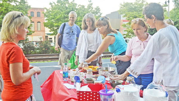 Rylee Barwell and Amelia Mesteca’s Fresh Tomato Salsa won the judges competition in the Tryon Farmers Market’s salsa competition held Thursday, July 25. Community members were encouraged to submit their favorite salsa recipe using ingredients from the market. The People’s Choice Award was Simple Tomatillo Salsa submitted by farmers market vendor Charlene Searcy. There were 10 entries in the competition overall ranging from traditional salsa with tomatoes, onions and peppers to unique blends with peaches and even blueberries. The Tryon Farmers Market takes place every Thursday from 4-6:30 p.m. (photos by Samantha Hurst)