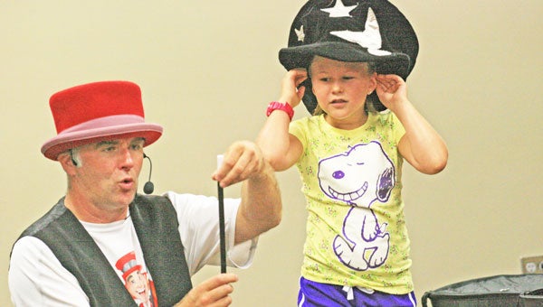 Professor Whizzpop performed his show “The Really Big Bookworm Dig” at both the Polk County Public Library and the Saluda Community Library on July 23. (photos courtesy Polk County Public Library Children’s Department Facebook page and Virginia Walker)