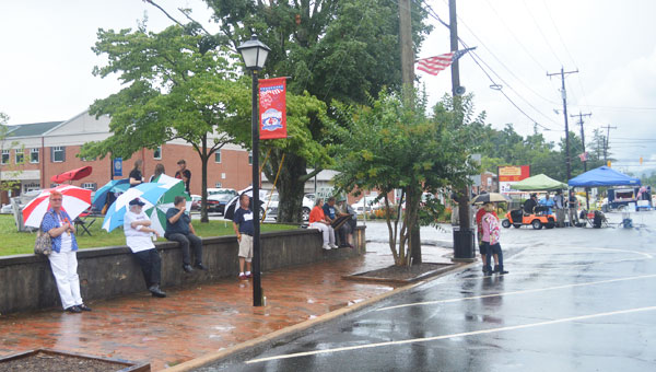 Several dozen people fought against the rain to get as much enjoyment out of the afternoon on July 4 in Columbus as possible. (photo by Samantha Hurst)