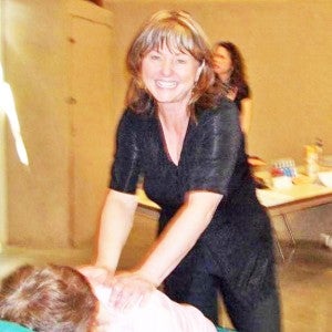 Lori Field working on a client. (photo submitted)