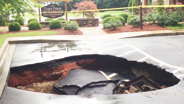 Heavy rains were expected to have caused this sink hole at Tryon Orthodontics. (photo submitted)