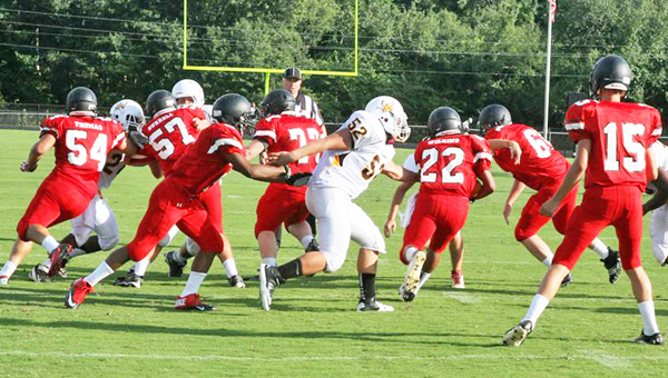 The North Carolina –South Carolina Fellowship of Christian Athletes football jamboree held at Boiling Springs High School Saturday, Aug. 10 involved eight teams, four from N.C. and four from S.C. There were eight quarters to the game, with each team playing for two quarters. Landrum High School beat Thomas Jefferson with a score of 14 to 7 at the end of their two quarters. Top: Jo Jo Wilkins (no. 22) takes off for another run. (photo by Lorin Browning)