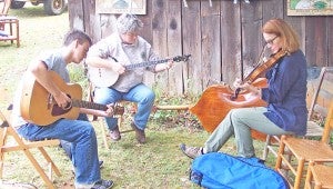 Musicians grab a seat and play during last year’s kiln opening festival. (photo submitted)