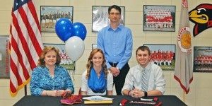 Sarah Cash, center, with parents Kelly and Kelly Cash, and coach Jeremy Darby. (photos by Mallory Shinault)