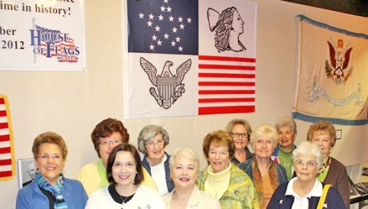 Members of the Landrum Garden Club with the 1817 “President’s Flag” in the center background. (photo submitted by Robert Williamson)