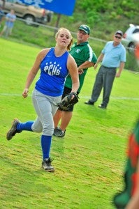 Polk first base tender Brandi Cordell charges after a foul pop, before the ball went just out of play. 