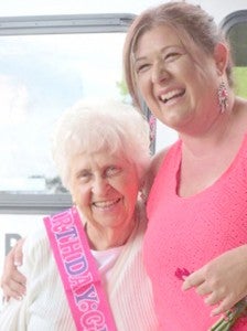 Miss Kay (Mildred Kay Weekley) receives a warm birthday hug from Katie Freeman during her ninety-second birthday celebration at Curves. (photo submitted by JoEllen Velazquez)