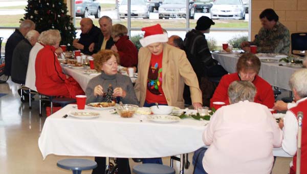 Members of the community enjoy their holiday meal at last year’s Shepherd’s Feast. Founder of the event, Ross Fox, hopes to reach even more people in the community at this year’s feast. (Photo by Elaine Pearsons)