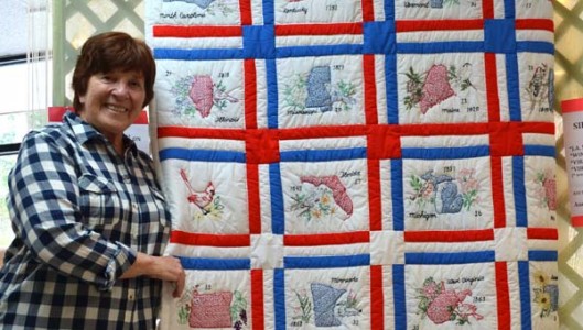 A beautiful quilt of obvious heritage quality was found in a box of donations to the Second Chance Thrift Store in Columbus in January. Recognizing its value as a significant piece of art and discovering the artists names on the back of the quilt inspired Ruby Drew, pictured, to go on a treasure hunt to find those who made it. (Photo submitted by Ruby Drew)