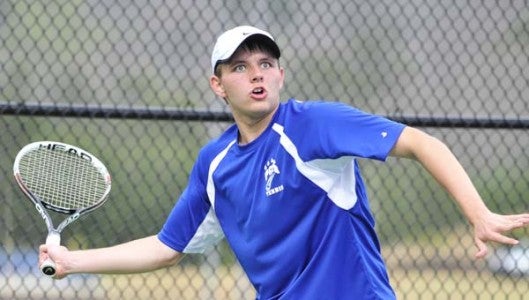 Polk County varsity's number one player, Tyler Oxtoby, competing against his Owen rival at Columbus on Thursday, March 26. Owen defeated Polk, 8-1. (Photo by Mark Schmerling)