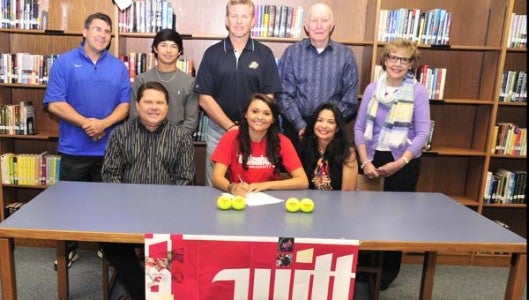 Alivia Livesay (front row, center), the pride of Polk County High School's women's tennis team, signed her intent on April 17 to play tennis on a scholarship at Wittenberg University in Springfield, Ohio. With her at her signing are, front row left to right, her parents, Kenny and Mary Livesay, and back row, from left: PCHS Director of Athletics Jeff Wilson, brother Bailey Livesay, PCHS Head Tennis Coach Richard Davis, grandfather Richard Kearns, and PCHS Principal Mary Feagan. (Photo by Mark Schmerling)