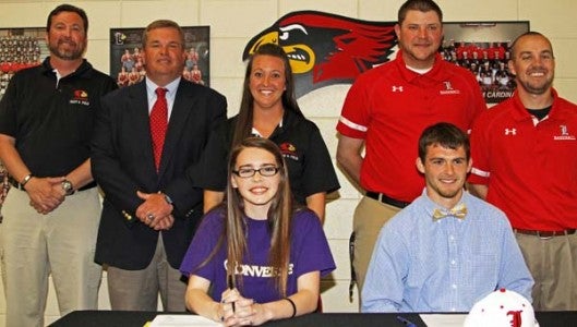 From row: Alison Jouan and Caleb Bruce. Back row:  Landrum track and field coaches Michael Cooper, Russell Mahaffey, Danielle Franklin, and Landrum baseball coaches Justin Henson and Daniel Little. (Photo by Lorin Browning)