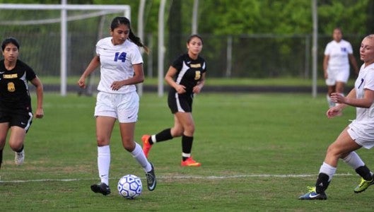 Polk County's Miriam Santabanez (14) put the Wolverines up, 4-0, against visiting Lincolnton in Wednesday's first round of state soccer tournament play. (Photo by Mark Schmerling)