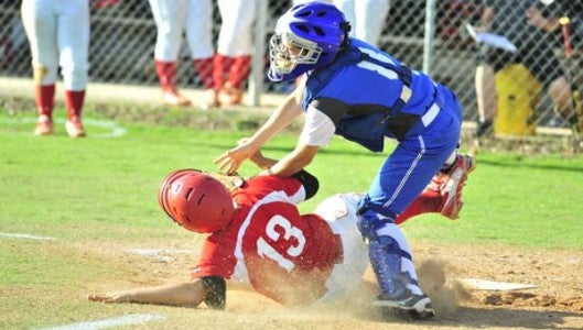 Catcher Ashley Kropp, who is shown making the tag, on an inning-ending double play, to hold Franklin's lead at 2-0. (Photo by Mark Schmerling)