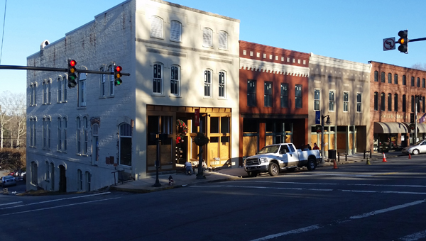 The Town of Tryon is currently discussing whether to take out a loan to complete the streetscape project in the Oak and Trade Street area of downtown at the Missildine’s building, currently being restored by Scott and Gayle Lane. The Lane’s say the plan is to have the restoration complete around the middle of 2016. (Photos by Leah Justice)